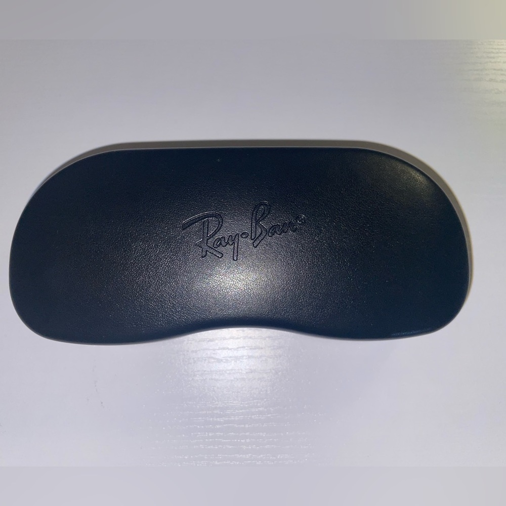 Ray-Ban eyeglasses hardshell case with black lens cleaning cloth.